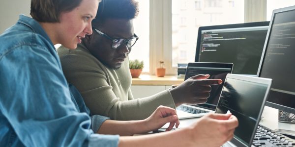 Programmers working with new software in team