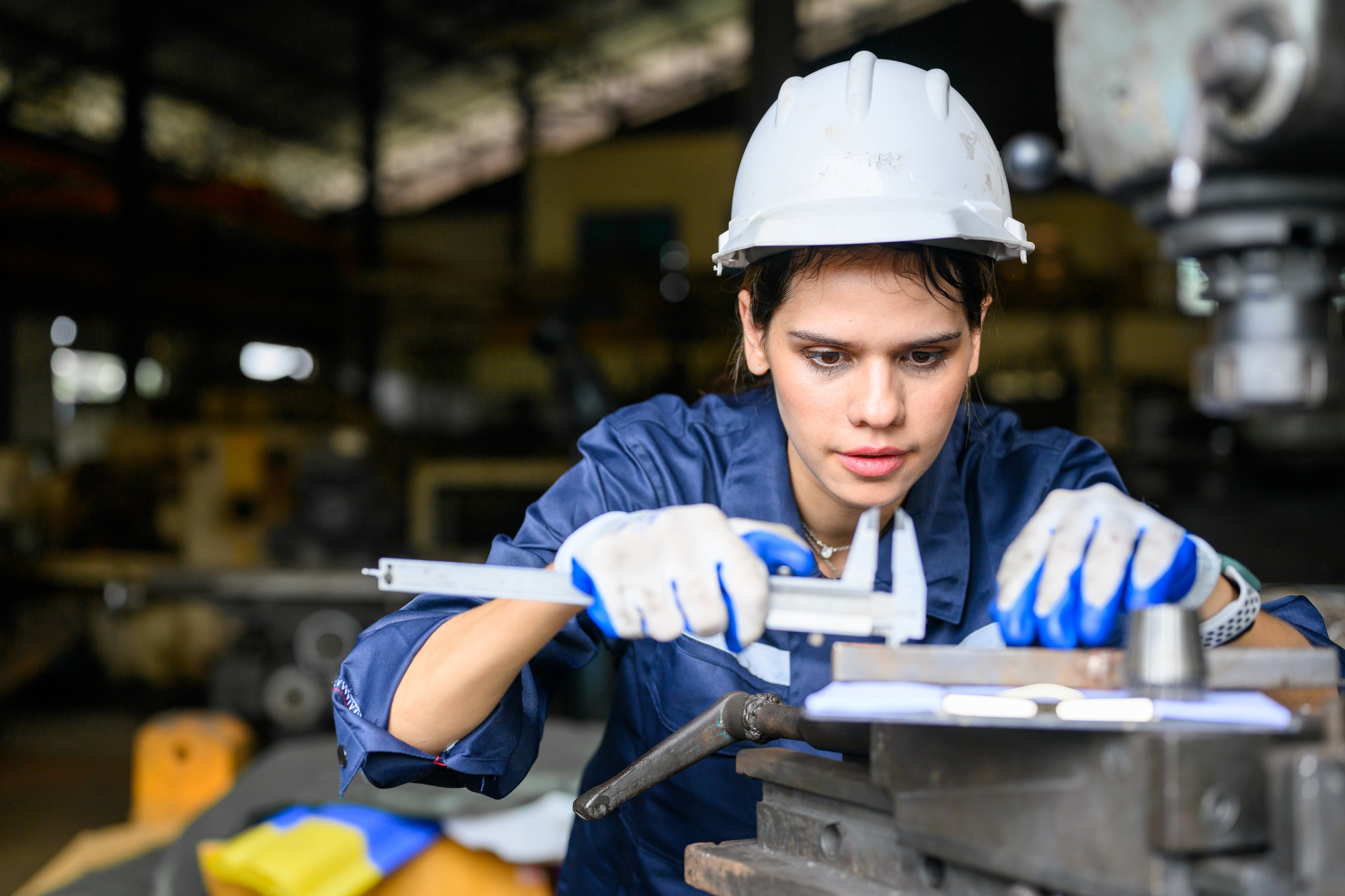 female-worker-with-safety-hard-hat-working-at-manufacturing-1.jpg