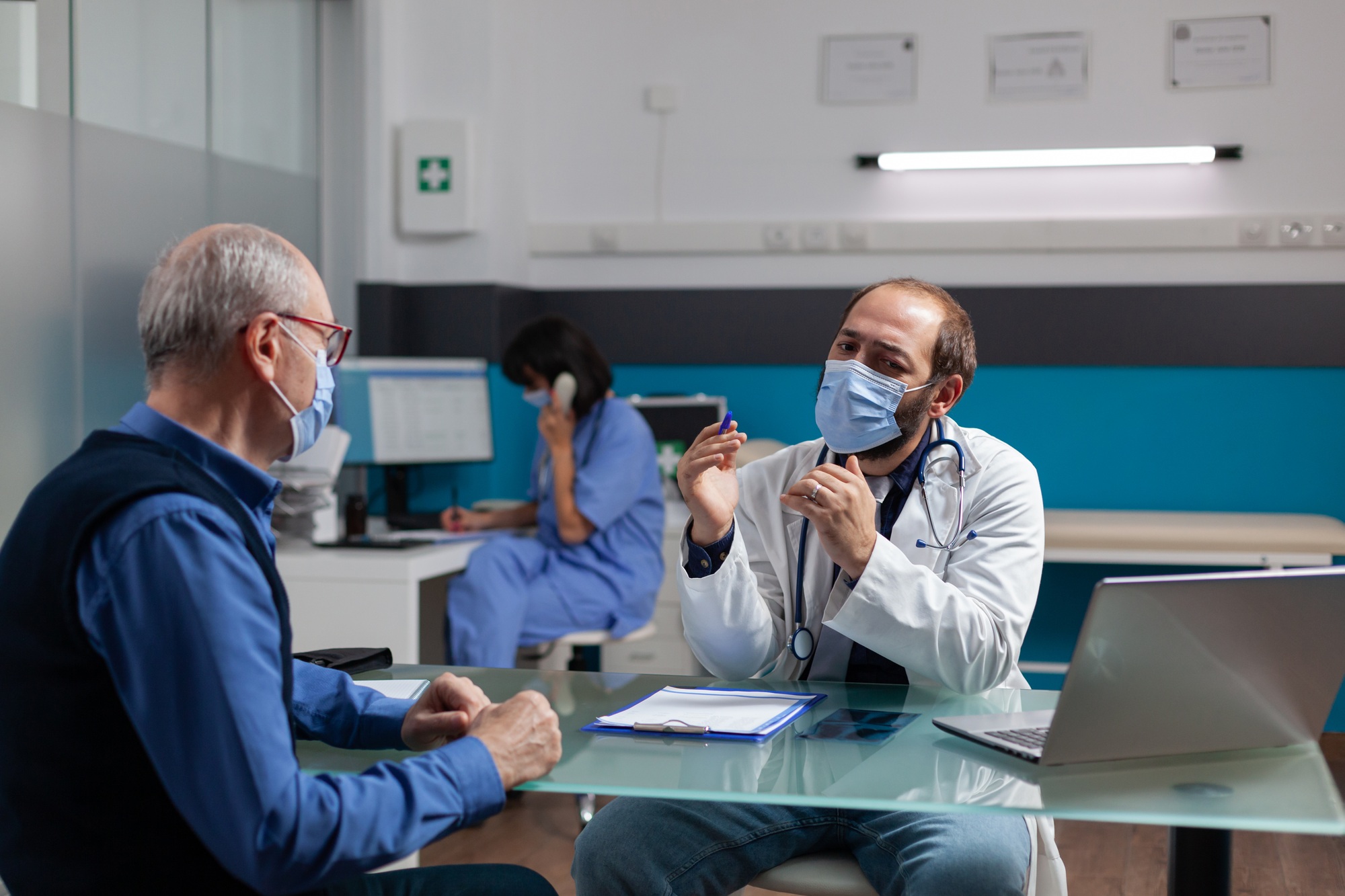 retired-man-and-physician-talking-about-health-care-medicine-1.jpg