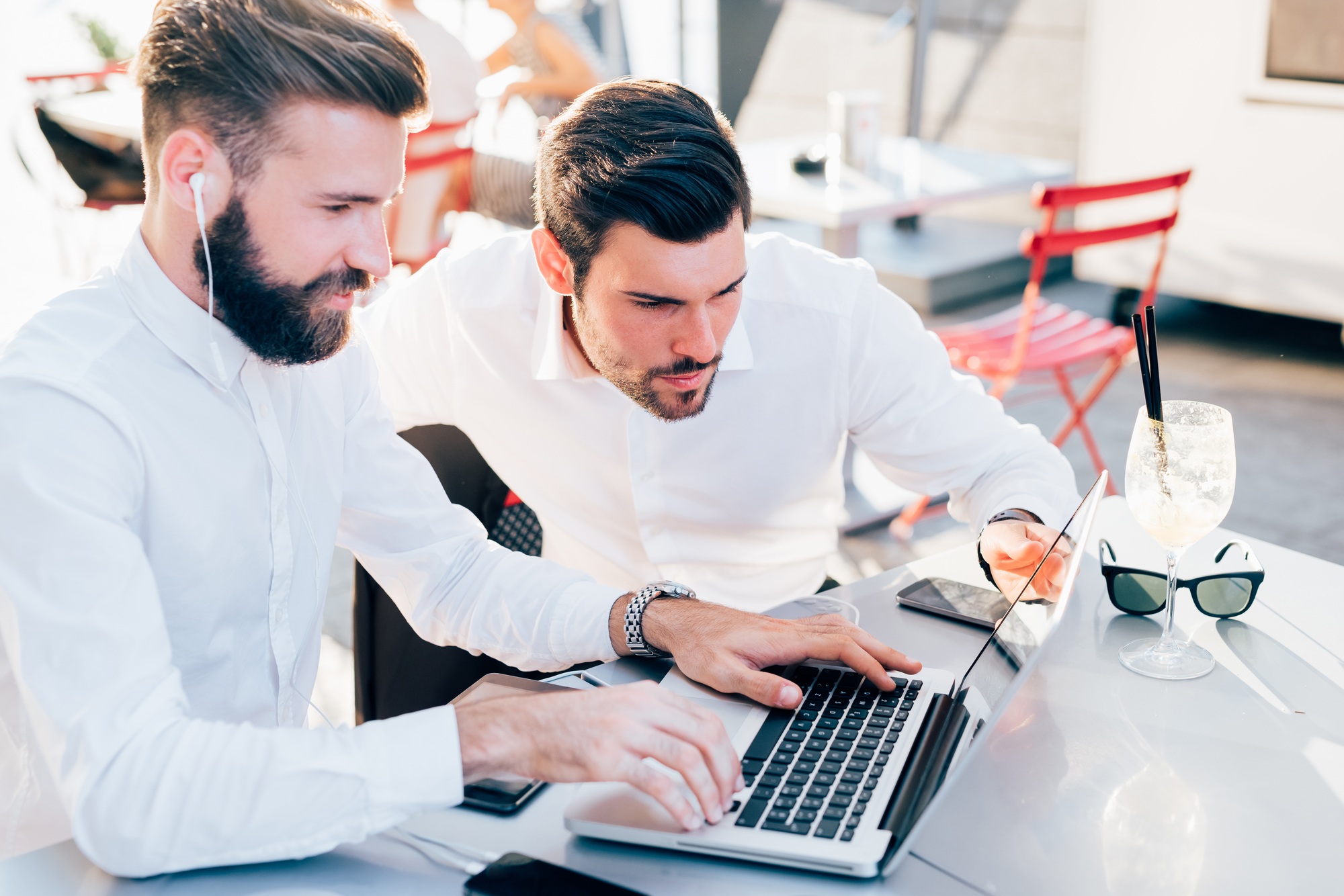 two-businessmen-outdoor-using-technology-1.jpg